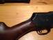 1996 Ford Bronco - Close-up view of a shotgun's wooden stock and metal receiver.