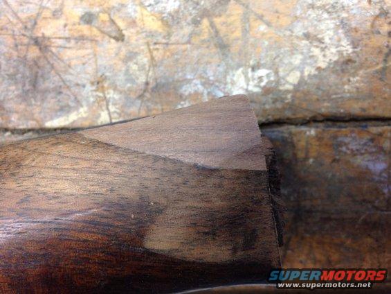 close-up of wood trim with a worn edge
