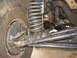 1988 Ford Bronco - This image shows the suspension system and tire of a vehicle, not a specific model year.