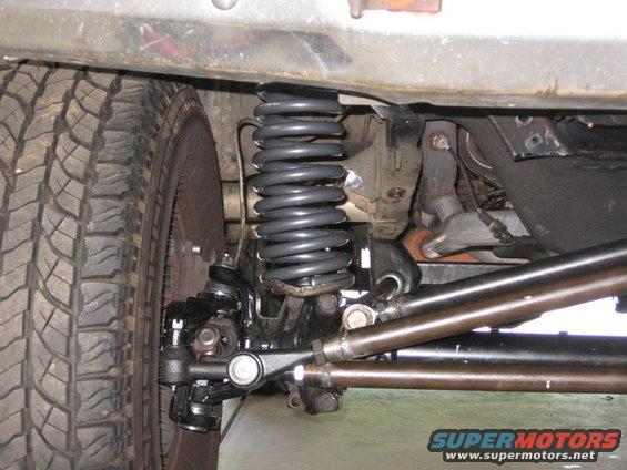 1988 Ford Bronco front suspension with coil spring and tire