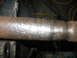 1988 Ford Bronco - A close-up view of a vehicle's driveshaft, showing wear and tear.