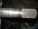 1988 Ford Bronco - Close-up of a splined metal shaft, likely a vehicle component, with visible rust and wear.