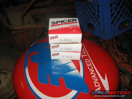 Three boxes of Spicer 5-760x parts stacked on a red and blue stool