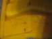 1988 Ford Bronco - A yellow plastic part with embossed text is shown, with a watermark at the bottom right.
