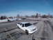 2006 Chevrolet Silverado 2500 - A white 2006 Chevrolet Silverado 2500 is parked in a lot with snow on the ground.