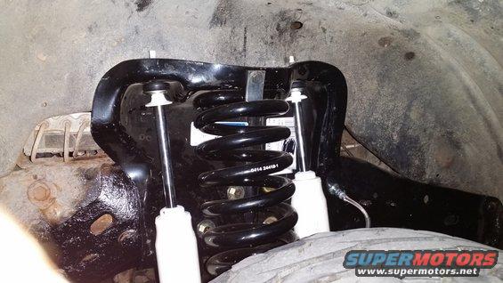 Front suspension coil spring and shock absorber assembly with part number D414 2841B1 visible