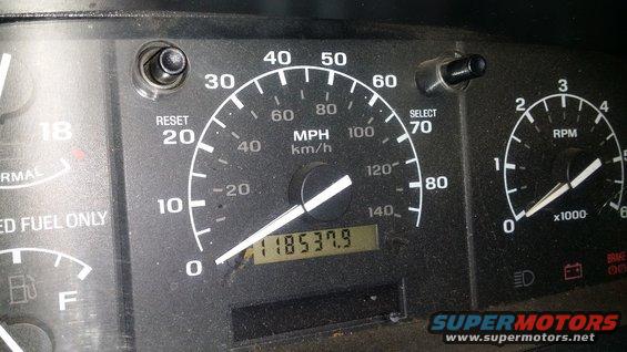 Dashboard gauges with odometer reading 118537.9