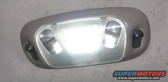 Gray interior dome light with two bulbs and black switches