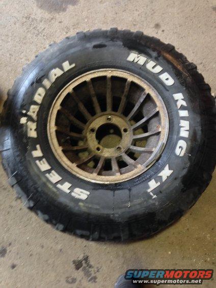 Mud King XT steel radial tire on a multi-spoke wheel