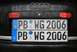 2003 Audi A6 - Two German license plates are stacked on the back of a car, both showing the same registration number.