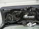2003 Audi A6 - Close-up view of the internal components of a car's trunk lid, showing the latch and wiring.