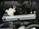 2003 Audi A6 - Close-up of a vehicle's trunk latch mechanism, showing electrical components and metal hardware.