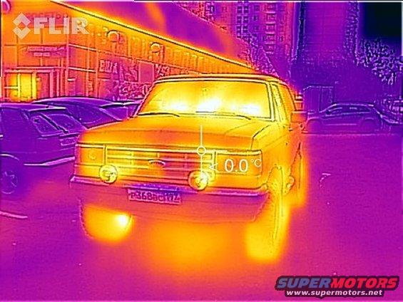 Front view of a yellow 1987 Ford Bronco with thermal imaging