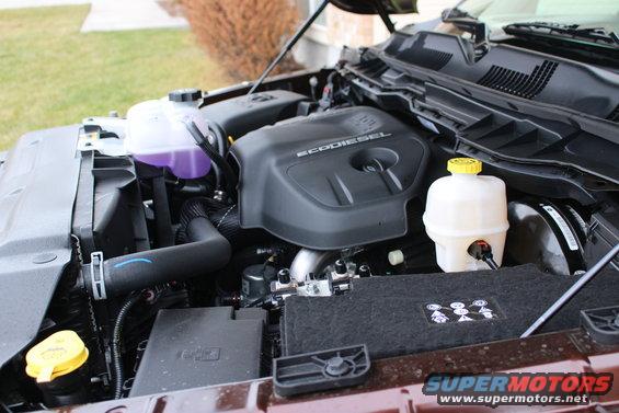 Engine bay with EcoDiesel engine cover and coolant reservoir