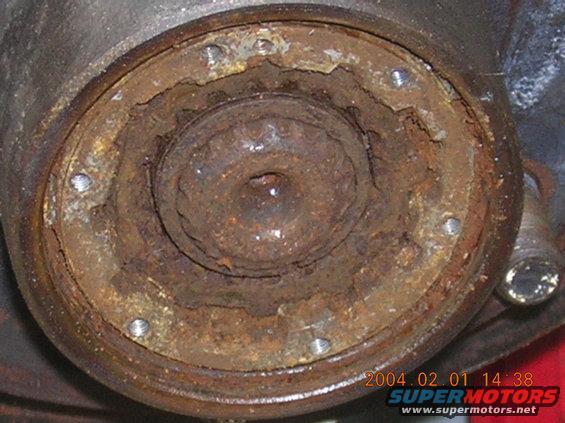 Rusted hub assembly with visible bolts and internal splines