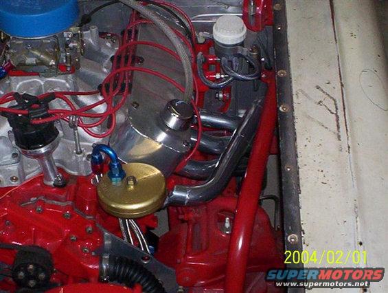 Engine bay with V8 engine, carburetor, distributor, and exhaust headers