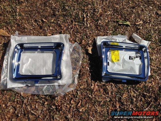Two chrome headlight bezels, one with a yellow tag