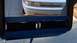 1993 Mercury Tracer - A white 1993 Mercury Tracer is visible behind a section of blue tape and black material.