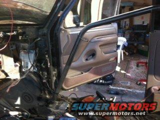Interior of a vehicle with a roll cage and exposed wiring