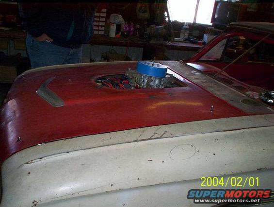 1963 Ford Falcon hood with aftermarket carburetor and air cleaner visible