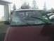 2000 Chevrolet Astro - Front view of a maroon 2000 Chevrolet Astro van showing a heavily damaged windshield.