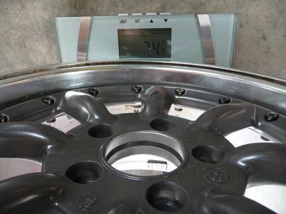 Wheel weighing 7.4 lbs on a digital scale