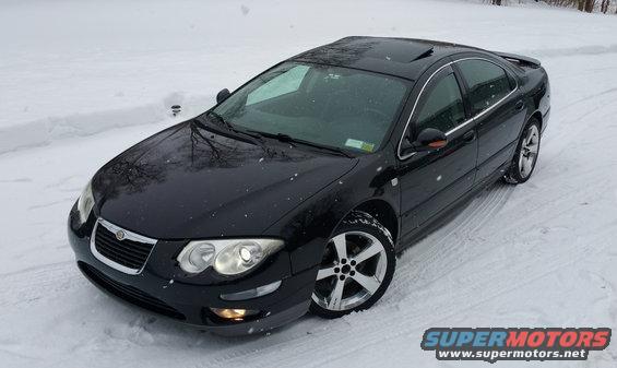 Black 2002 Chrysler 300M parked in snow, front 3/4 view