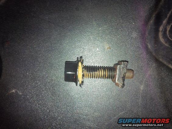 Bolt and nut assembly with a black cap and serrated washer