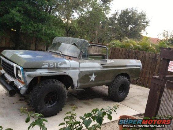 Modified 1978 Ford Bronco with custom paint, star decal, and off-road tires