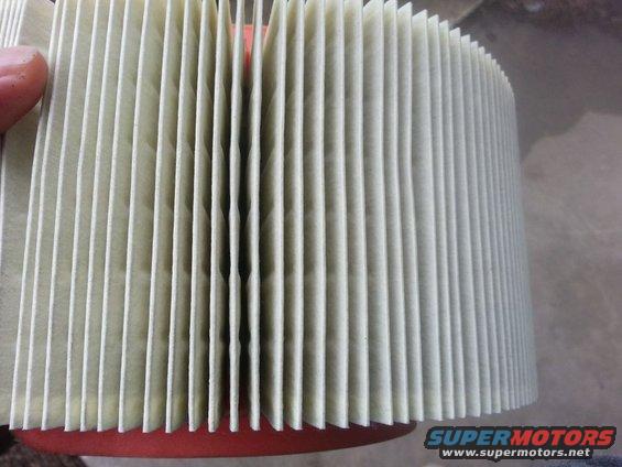 Air filter with pleated paper element and red rubber seal