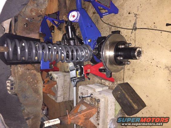 Front suspension and brake assembly with coil spring on jack stands
