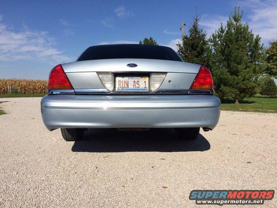2003 Ford Crown Victoria rear view, silver paint, Illinois license plate 'RUN AS 1'