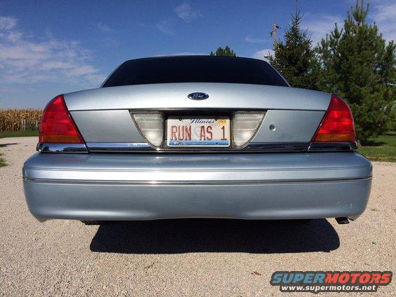 Rear view of a light blue Ford Crown Victoria with an Illinois license plate that says RUN AS 1