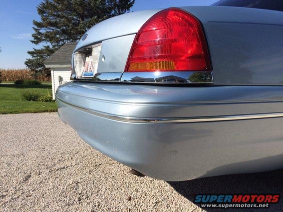 Light blue 2003 Ford Crown Victoria rear bumper and taillight