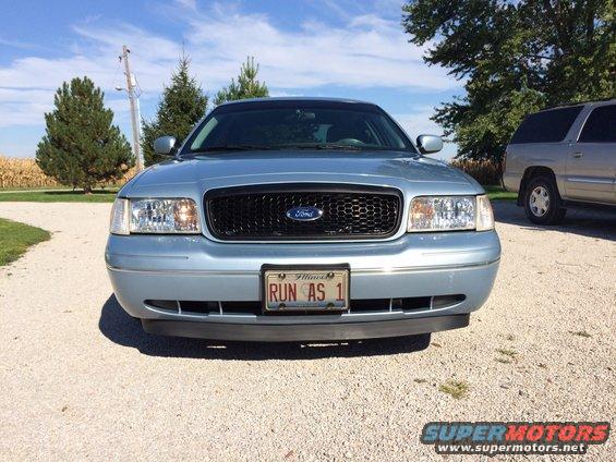 Blue 2003 Ford Crown Victoria front view, black grille, Illinois license plate 'RUN AS 1'