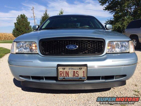 Light blue 2003 Ford Crown Victoria front view with custom license plate