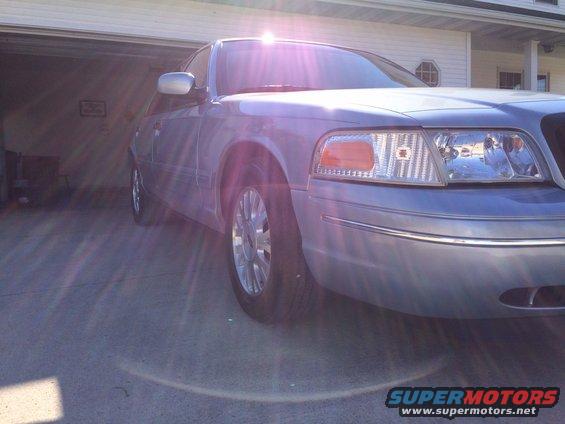 Blue 2003 Ford Crown Victoria parked in a driveway, front 3/4 view
