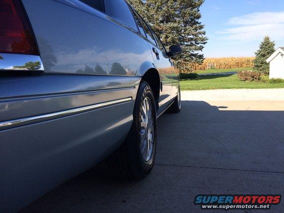 Side view of a 2003 Ford Crown Victoria parked on a driveway