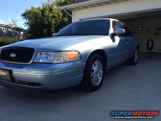 Light blue 2003 Ford Crown Victoria sedan, 3/4 front view