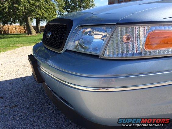 Blue 2003 Ford Crown Victoria front grille and headlights