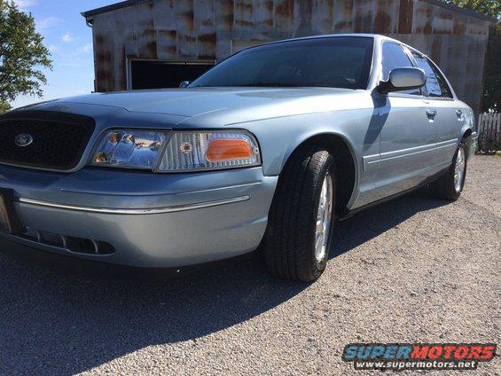Light blue 2003 Ford Crown Victoria front 3/4 view
