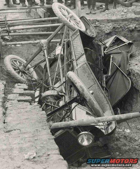 1915 Ford Model T overturned in a ditch, side view