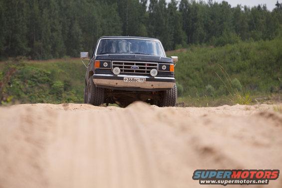 1987 Ford Bronco front view on dirt road