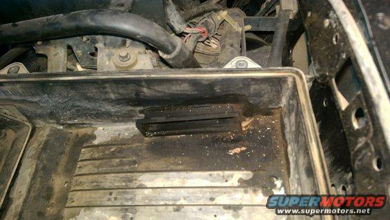 Dirty air filter housing with black rubber seal and wiring harness