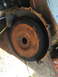 1971 Ford F-250 - A heavily rusted flywheel and bell housing assembly is shown, with visible gear teeth and mounting bolt holes.