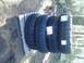 1971 Ford F-250 - Four off-road tires are stacked on a wooden pallet, ready for installation.