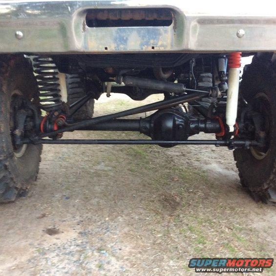 1979 Ford Bronco rear axle, suspension, and shocks. Off-road tires visible