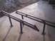 1991 Ford Bronco - Two custom metal ramps are shown on a concrete surface.