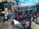 1991 Ford Bronco - Ford V8 engine on an engine stand, showing the distributor, oil filter, and exhaust manifolds.