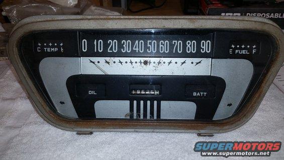 Vintage dashboard gauge cluster with speedometer, fuel, oil, and battery indicators